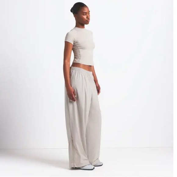 SKIMS Pants - 🩶 SKIMS Stone Woven Nylon Track Pants Nike